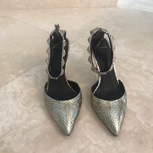 Brian Atwood silver metallic ankle strap pumps.